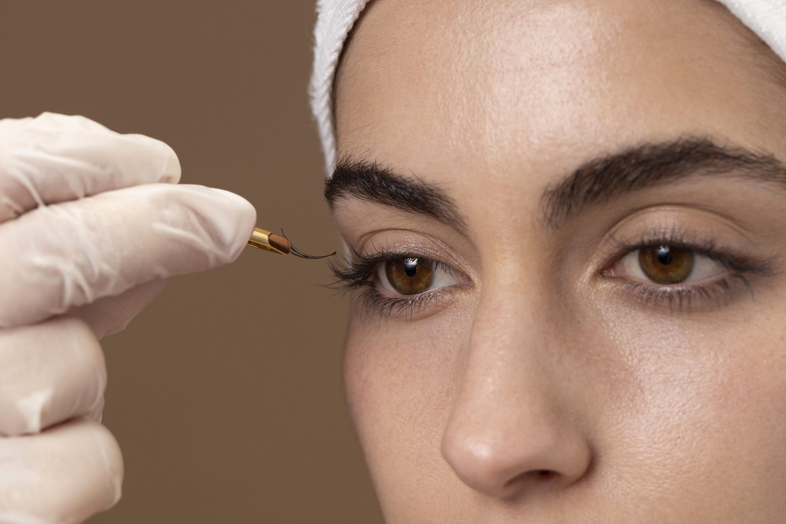 woman-doing-an-eyelashes-treatment-to-her-client